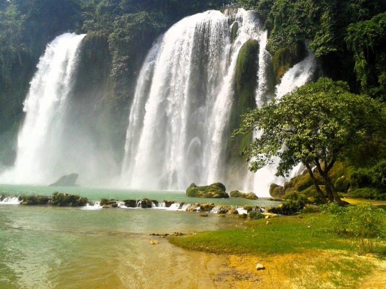 Ban Gioc Waterfall cascading into a turquoise pool - Rose Travel