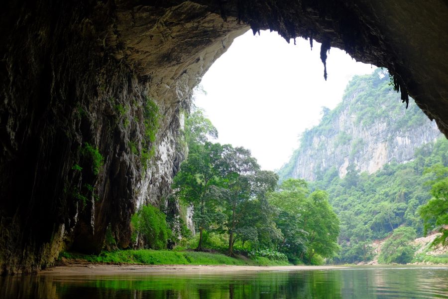 Boat entrance of Puong Cave on the Nang River, Ba Be