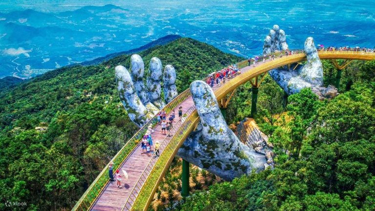Golden Bridge held by giant stone hands at Ba Na Hills - Rose Travel