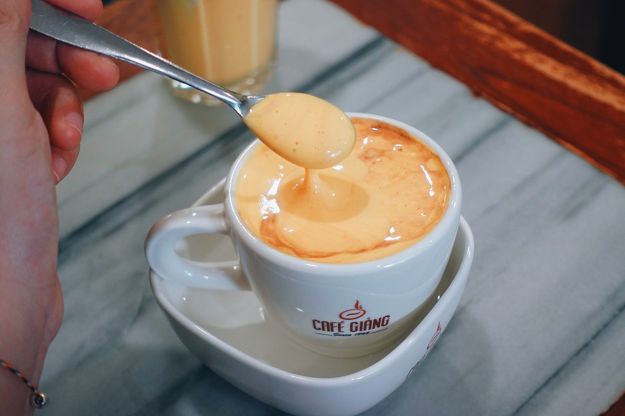 Hanoi egg coffee being stirred