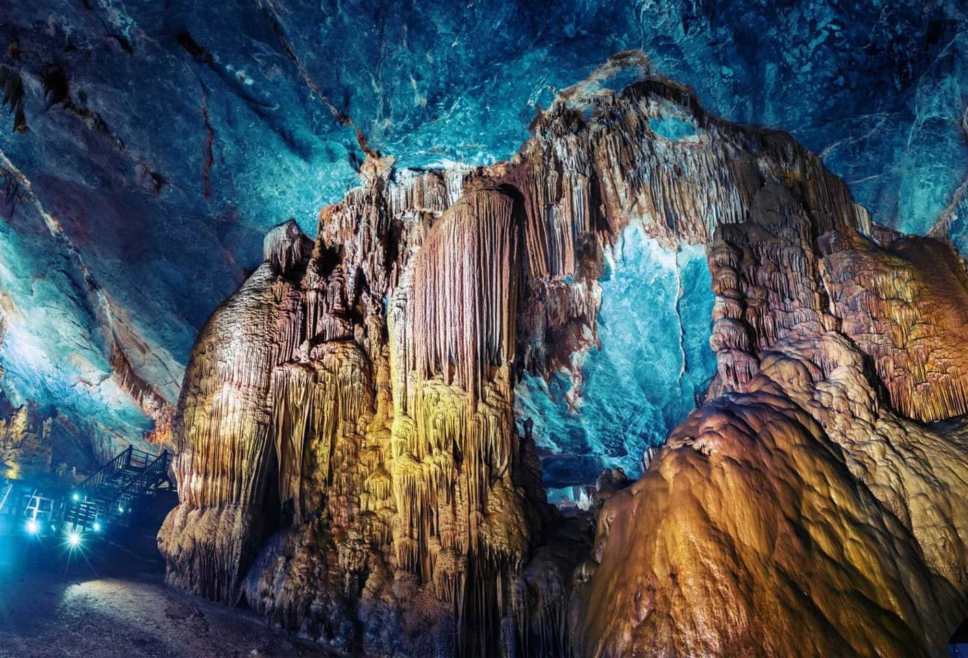 Illuminated stalactites inside Paradise Cave