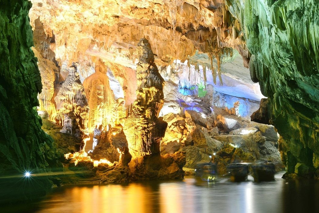 Cave formations reflected in the underground river of Phong Nha Cave