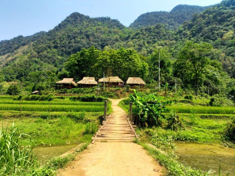 Bamboo bridge leading to a Thai stilt-house village - Rose Travel